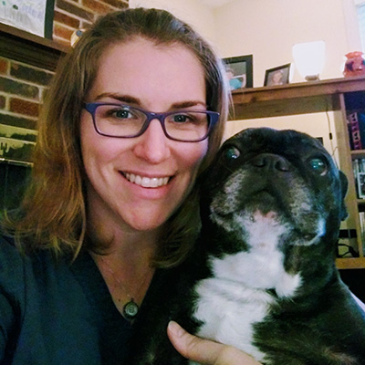 woman holding french bulldog